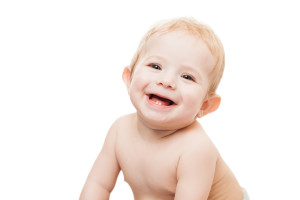 Little cute newborn baby child first milk or temporary teeth smiling face white isolated