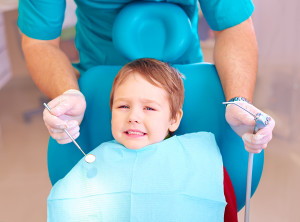 little kid patient afraid of dentist while visiting dental clinic